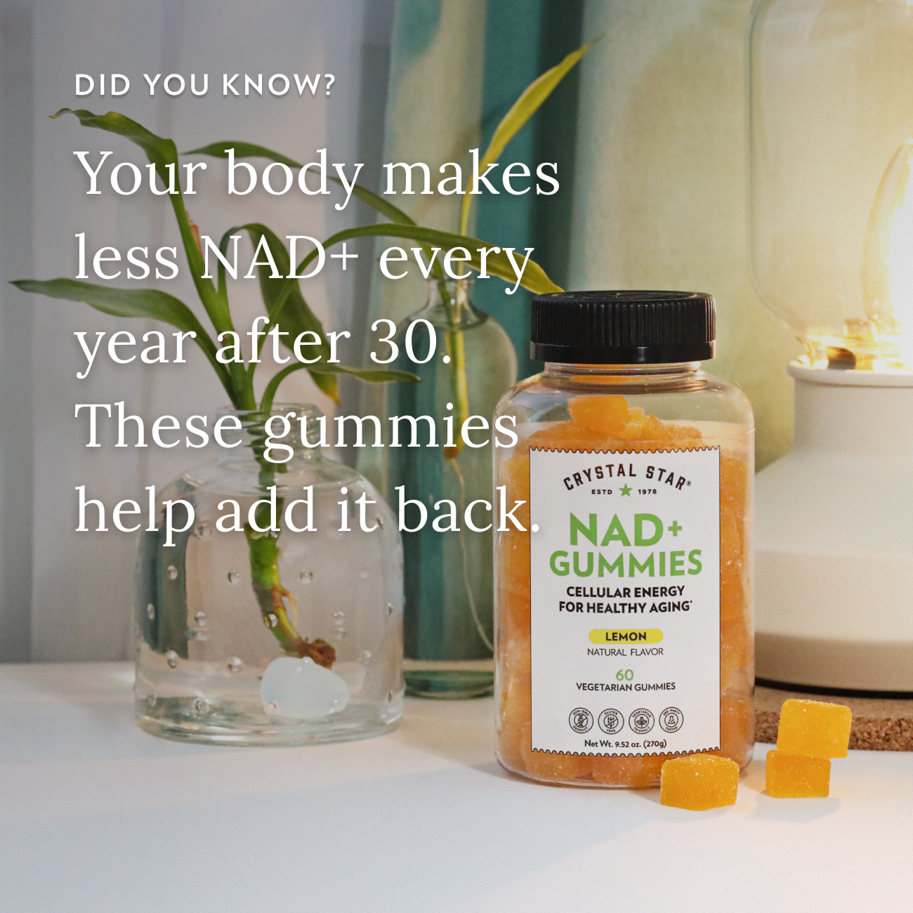Crystal Star NAD+ Gummies bottle with text about NAD+ levels and gummies' benefits on a table.